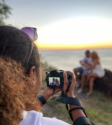 a woman taking a picture of a man and woman