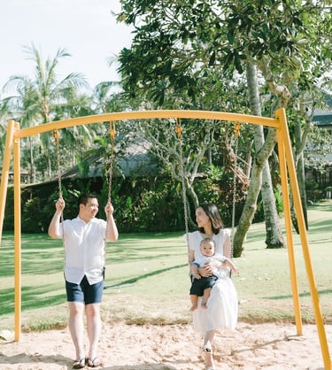 Family playing at resort playground in Intercontinental Jimbaran captured in a candid and joyful family photography session