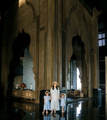 Family photography inside The Grand Lobby at The Apurva Kempinski Bali with dramatic architectural interiors