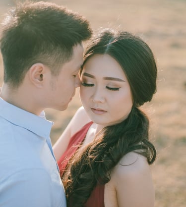 Close emotional portrait of intimate couple during sunset at Pantai Nyanyi Bali.