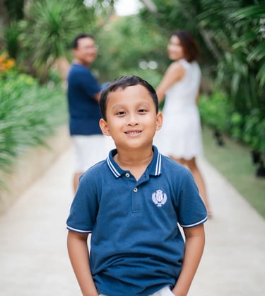 Boy portrait on tropical walkway during family session at The Mulia Nusa Dua Bali