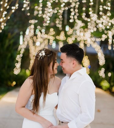Romantic couple portrait under warm garden lights during a prewedding photoshoot at Apurva Kempinski Bali