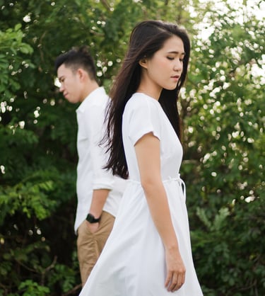 Couple walking near greenery during proposal photoshoot at Melasti Beach Bali