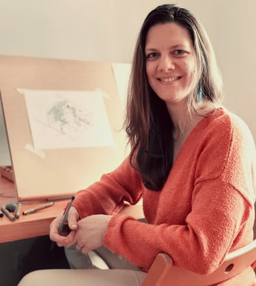 a woman sitting in a chair with a pen