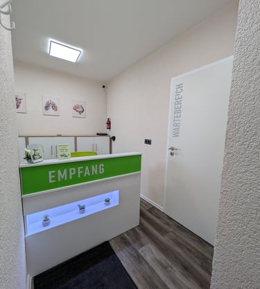 a reception desk with a green and white reception table