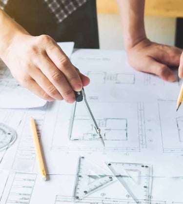 a man and woman working on a project