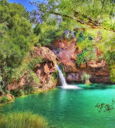 a waterfall in a canyon near a waterfall