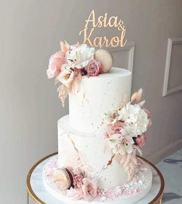a white cake with a gold cake topperf
