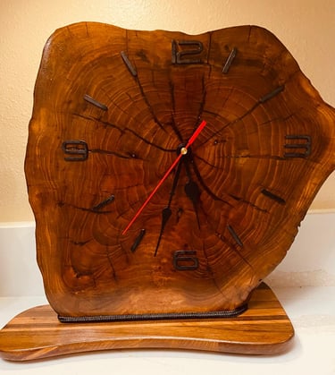 Edged wooden slab clock for table or shelf.