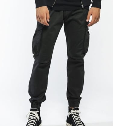 a man in a black hoodie and black pants