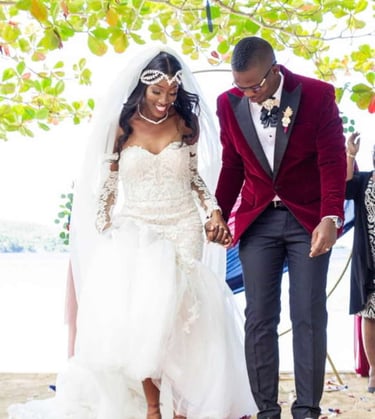 a bride and groom walking down the aisle of a beach wedding