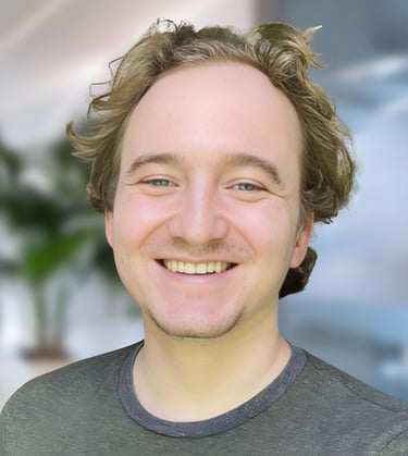 a man with a beard and a beard smiling