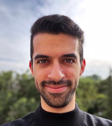 a man with a beard and a black sweater