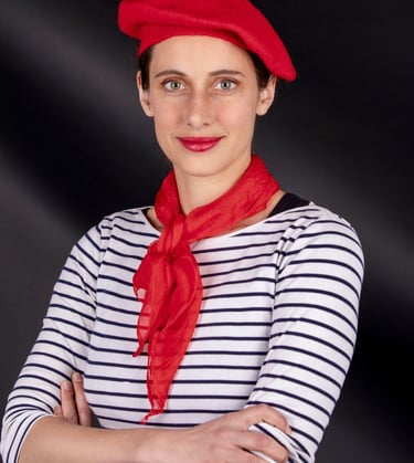 a beautiful French woman teacher in a French costume poses for a picture she is the best tutor