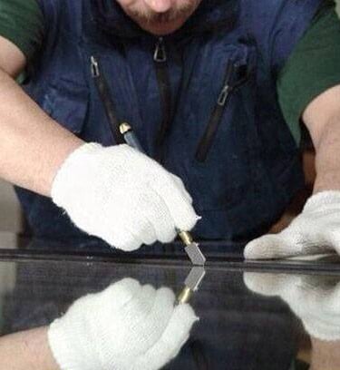 a man in a blue shirt and white gloves