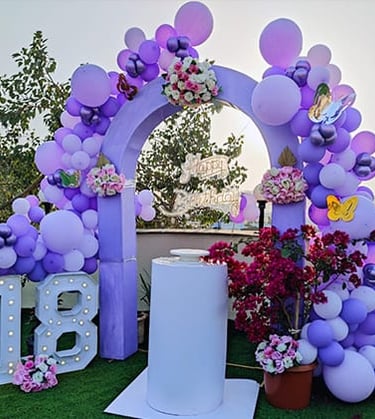 a purple arch shaped balloon - shaped arch shaped balloon
