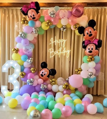 a birthday party with balloons and balloons