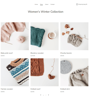 A collection of handmade knitwear including sweaters, scarves, and beanies for a women's winter clothing shop.