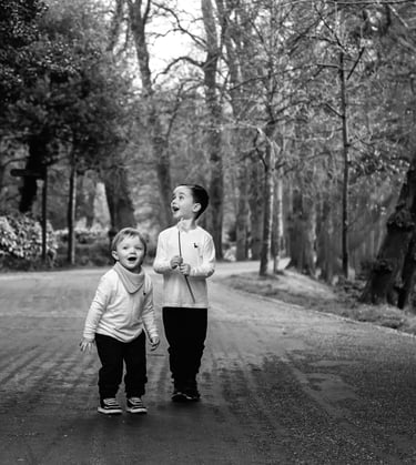 a woman and her son walking down a path