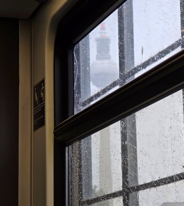 a window with a view of a city skyline