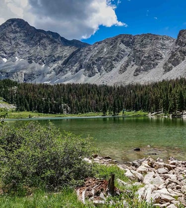 a lake with a mountain in the background