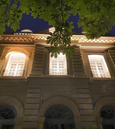 a building with a clock tower in the middle of the night