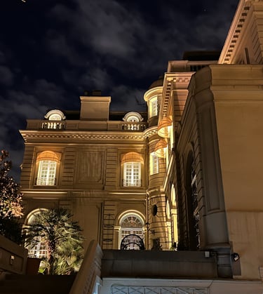 a building with stairs and a clock tower