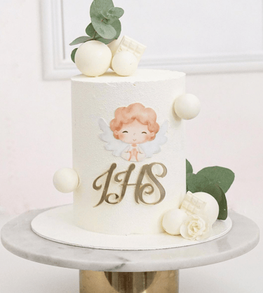 a cake with a white cake topperf and a gold cupcake