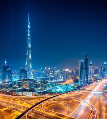The vibrant Dubai cityscape at night, a global hub for business and innovation.