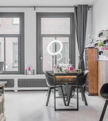 a living room with a dining table and chairs