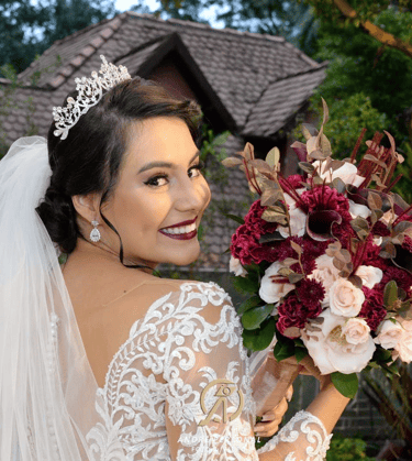 a woman in a wedding dress holding a bouquet