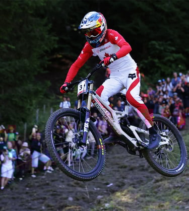 a person riding a bike on a hill