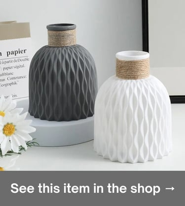 White & gray textured ceramic vases with rope accents for minimalist Scandi home decor