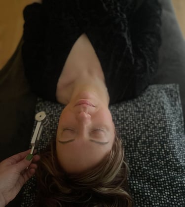 a woman during a sound therapy session