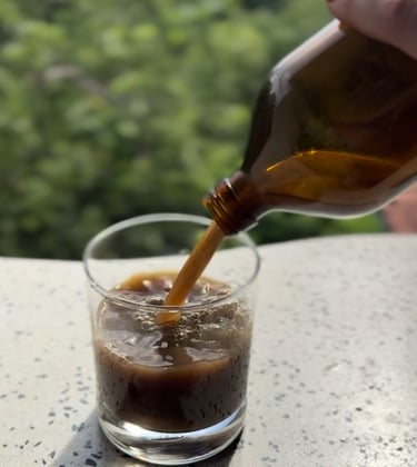 Ayurvedic medicine tonic being poured in a glass