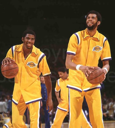 Magic Johnson and Kareem Abdul-Jabbar of the Los Angeles Lakers at the Forum in 1980 by James Drake