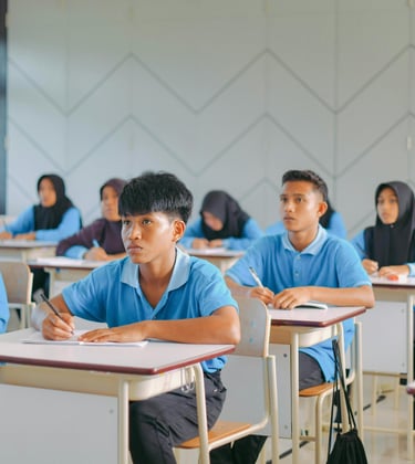Malaysian students in a classroom prep for SPM and UASA using PNI Neuron visual learning for memory mastery.