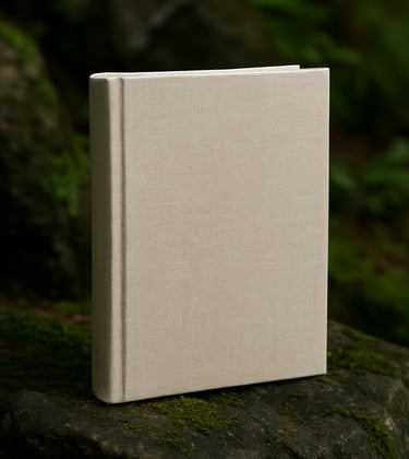 A professionally bound textbook with a linen texture, standing upright against a backdrop of dark mossy rocks and forest greenery. The lighting is crisp and the style is grounded and professional.