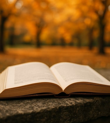 A close-up photograph of an open academic textbook with crisp parchment pages, resting on a weathered stone ledge in a North American park during autumn, with blurred golden leaves in the background.