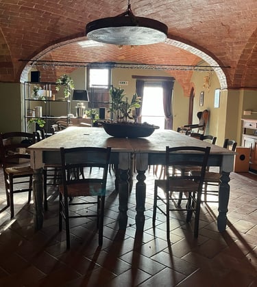 a dining room with a table and chairs