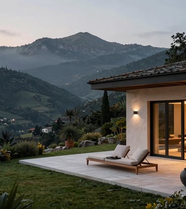 A serene, luxury private villa terrace overlooking a vast, misty mountain range in the Iberian region. The architecture features clean lines and natural materials. Twilight lighting creates a calm, exclusive atmosphere with deep green and gold accents in the decor. High-end lifestyle photography.