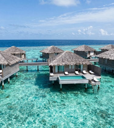 A luxury tropical resort in the Maldives with overwater bungalows and crystal-clear turquoise water, bright natural lighting, professional travel photography style. South American / Brazilian vacation vibe.