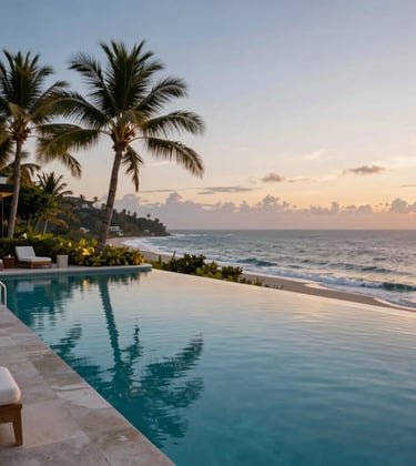 A high-end private infinity pool overlooking a tropical coastline at dusk, featuring soft golden and blue hour lighting. North American / International luxury aesthetic.
