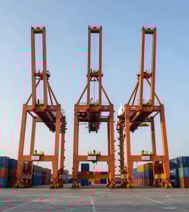 A modern container port terminal with high-reaching orange cranes and stacked blue containers under a clear sky, symmetrical composition, professional photography.