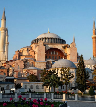 Photography of the Hagia Sophia Mosque in Trabzon, highlighting its historic red-brick Byzantine architecture and arched windows against a bright sky blue morning sky, surrounded by vibrant local flora, Eastern European / Turkish setting.
