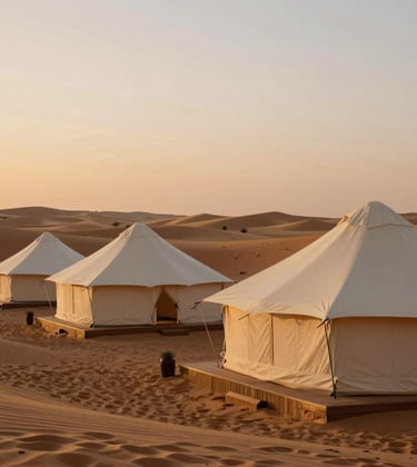 A high-end private glamping setup in the Agafay desert. Luxurious Ivory tents under a soft Bronze sunset, capturing the essence of North African / Moroccan adventure.