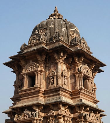 A professional shot focusing on the ornate stone carvings of a historical South Asian / Indian monument, medium blue sky in the background, sharp architectural details.