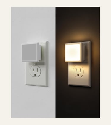 A side-by-side comparison of a square LED plug-in night light in daylight and glowing in the dark.