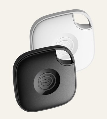 Black and white Tile Mate Bluetooth trackers for finding lost keys and luggage.