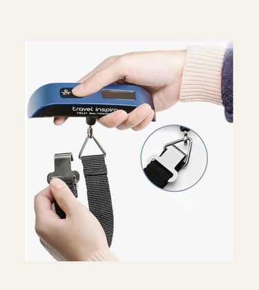 Portable digital luggage scale with a blue handle being held to weigh a suitcase with a strap.